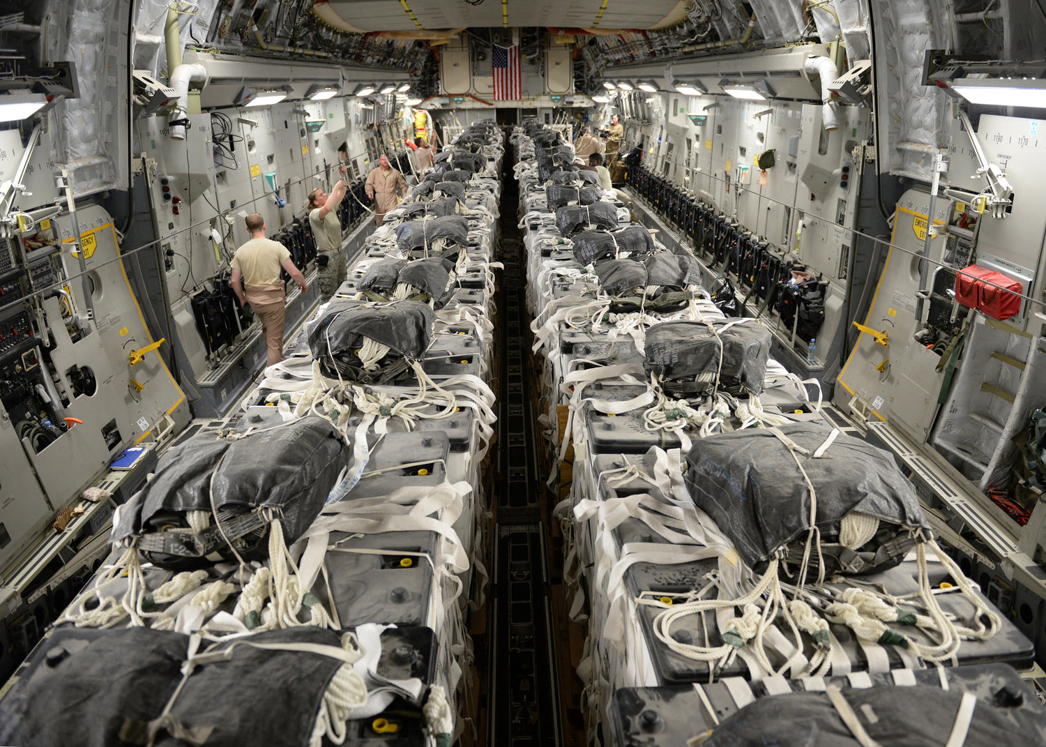 High velocity cargo parachutes have been rigged inside the plane for humanitarian aid to be dropped in Syria.