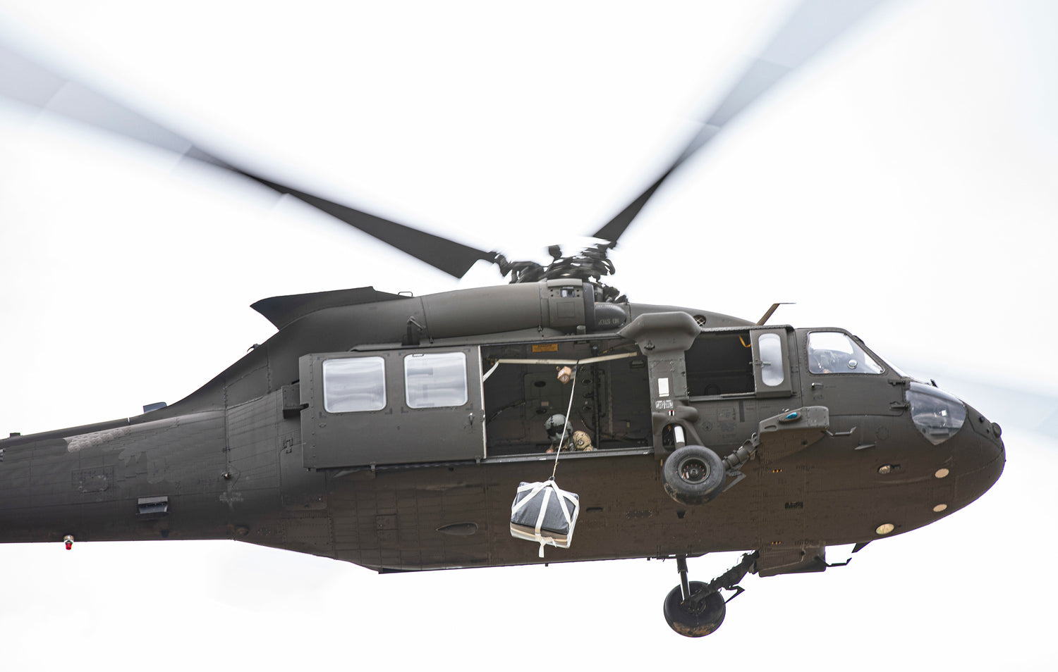 The enhanced speed bag system shows the payload beginning its descent from the Black Hawk Helicopter. Usually they hover around 100' above ground level.