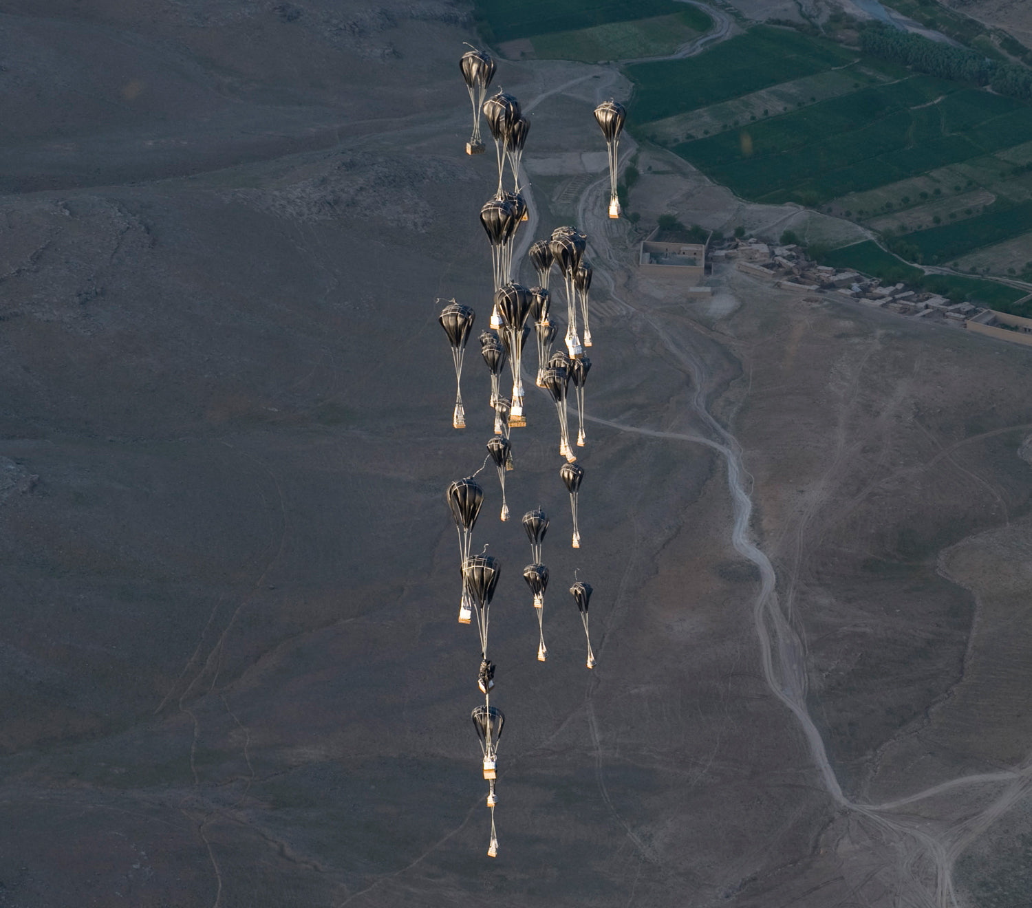 High velocity cargo parachutes deployed at a high altitude to delivery supplies to troops on the ground.