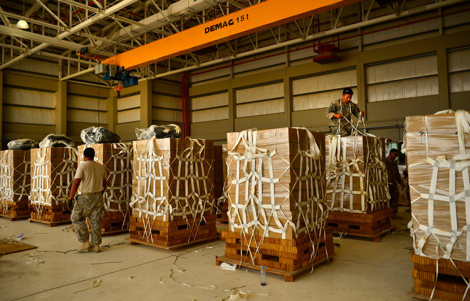 Multiple payloads are lined up and prepared for a cargo parachute delivery for humanitarian aid. The high velocity parachutes are stacked on top of the cargo and the low cost container wraps around the cargo where the parachute will be connected. Rigged in Jordan airdropped in Syria.